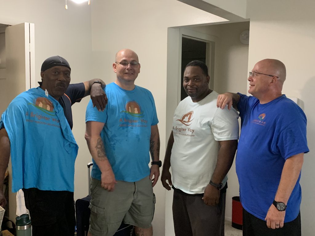team members at a brighter way helping to move Arthur a formerly incarcerated man into his new apartment