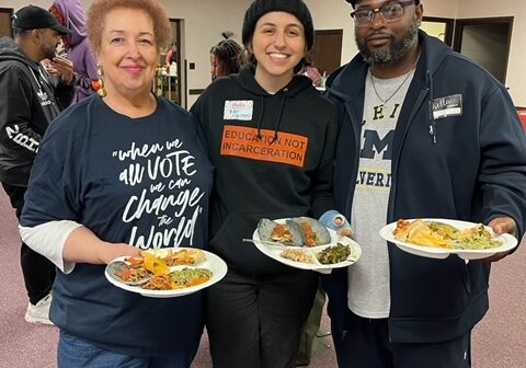 A brighter way staff and board members at an event with plates of food