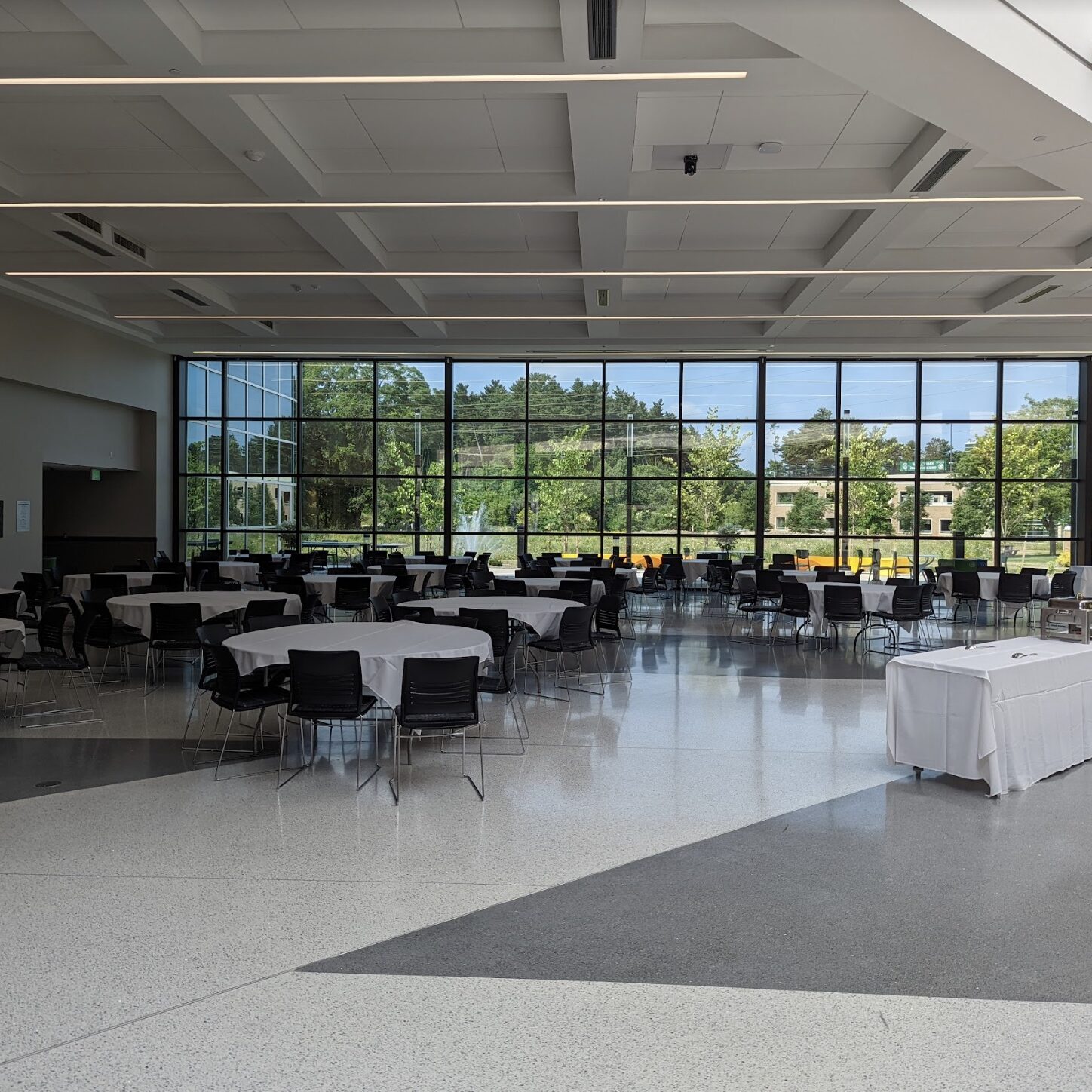 high ceiling room with tables and chairs at Washtenaw Community College in Ypsilanti Michigan
